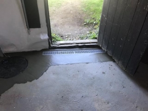 Open Trench Drain a door entrance landing.