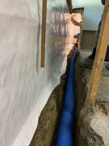 High Octane slotted pipe with installation of Vapor Barrier tying into drainage system