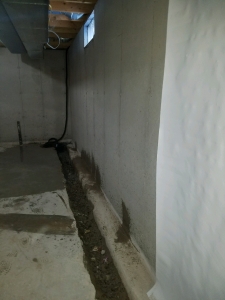 Breakout for system install beside foundation footing.