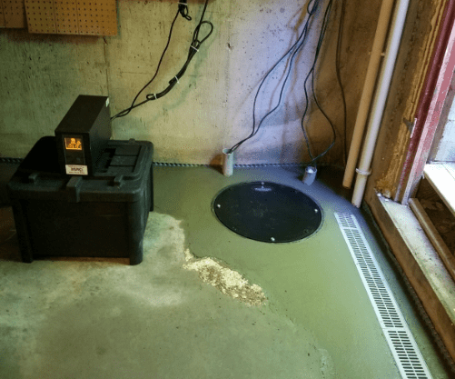 Black in-floor sump pump