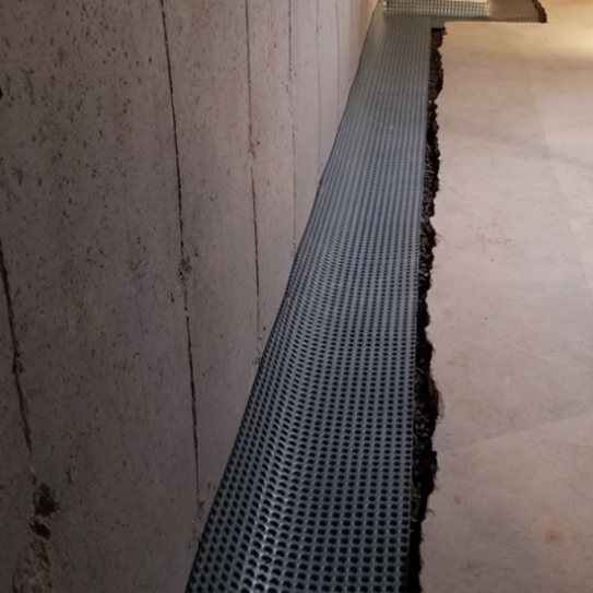 Basement drain tiles by Premier Basement Waterproofing in Lunenburg, MA